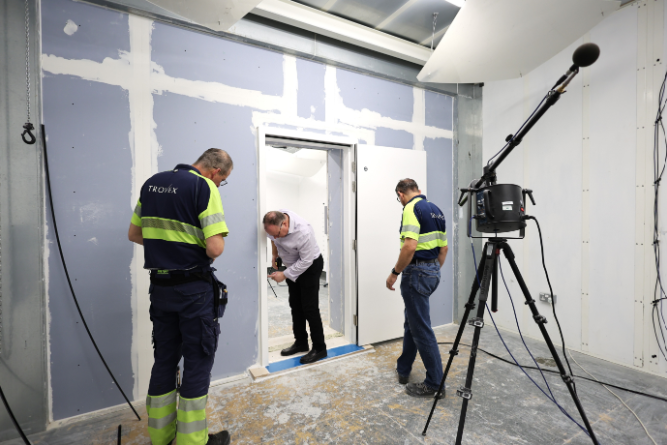 Trovex team installing fire rated acoustic rated door
